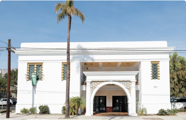 SCRC Santa Barbara fertility clinic building with a palm tree in front